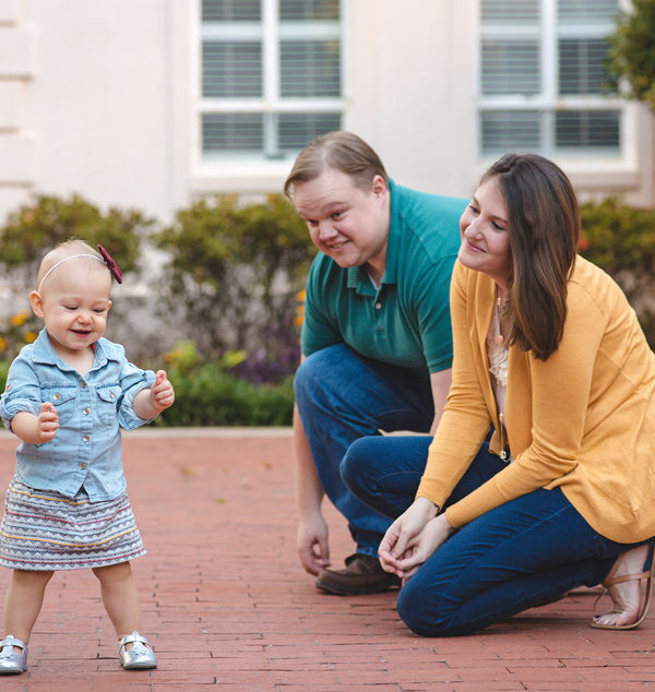 family of three with little girl